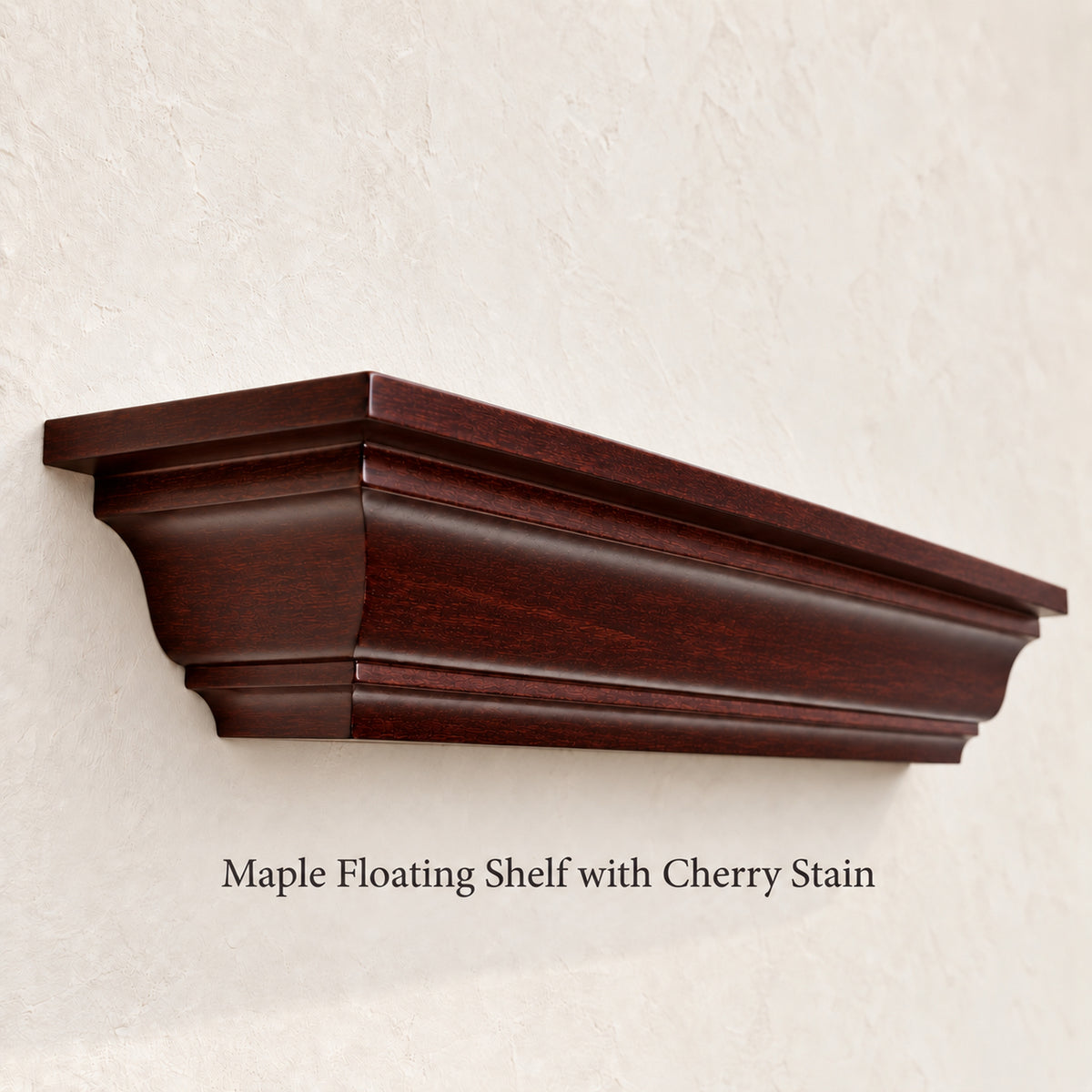 A dark cherry wood crown molding floating shelf on a white background. Text reads 'Maple Floating Shelf with Cherry Stain'