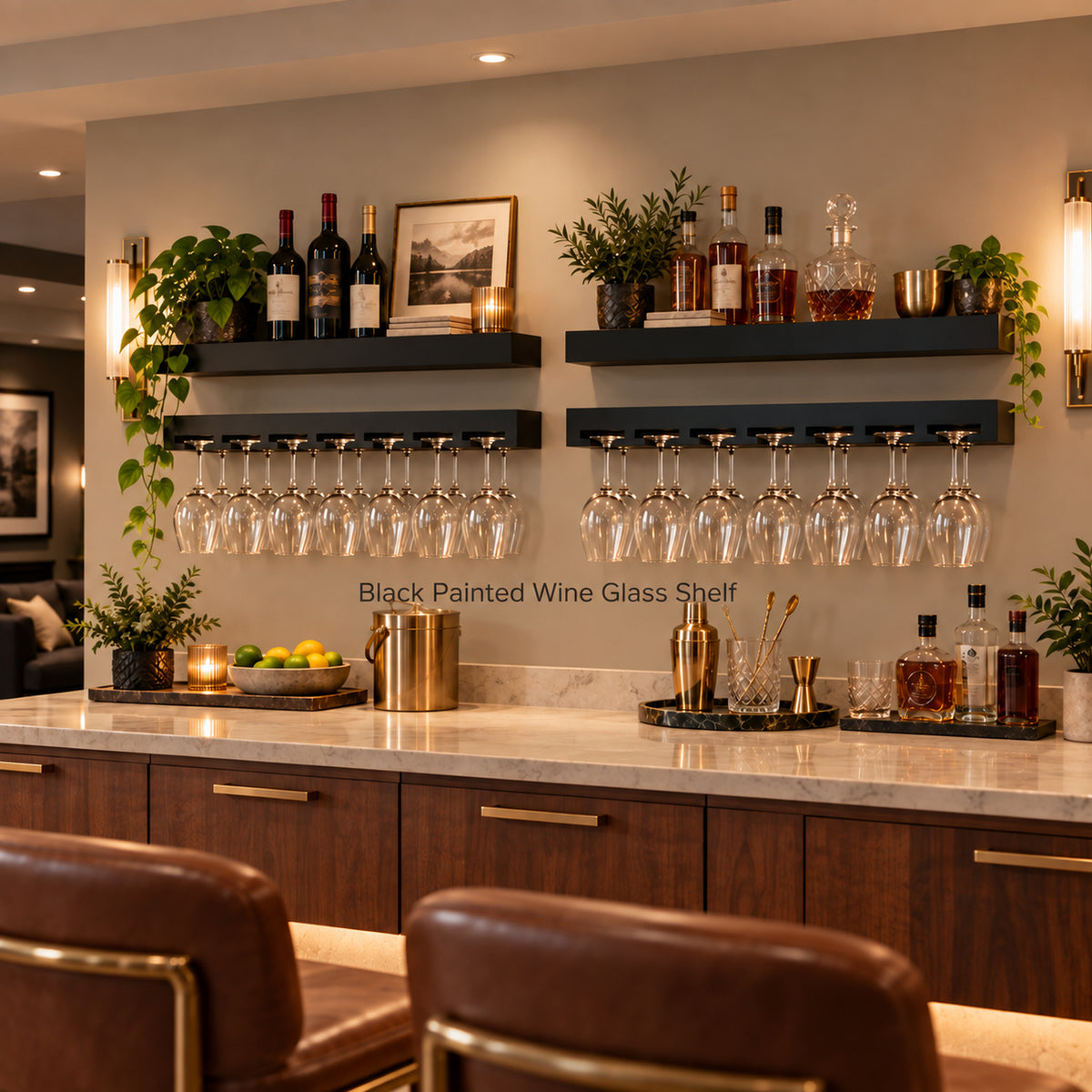 Two black painted wine glass shelves mounted above a marble bar counter, holding multiple wine glasses and styled with bottles, plants, and wall sconces in a modern basement bar setting.